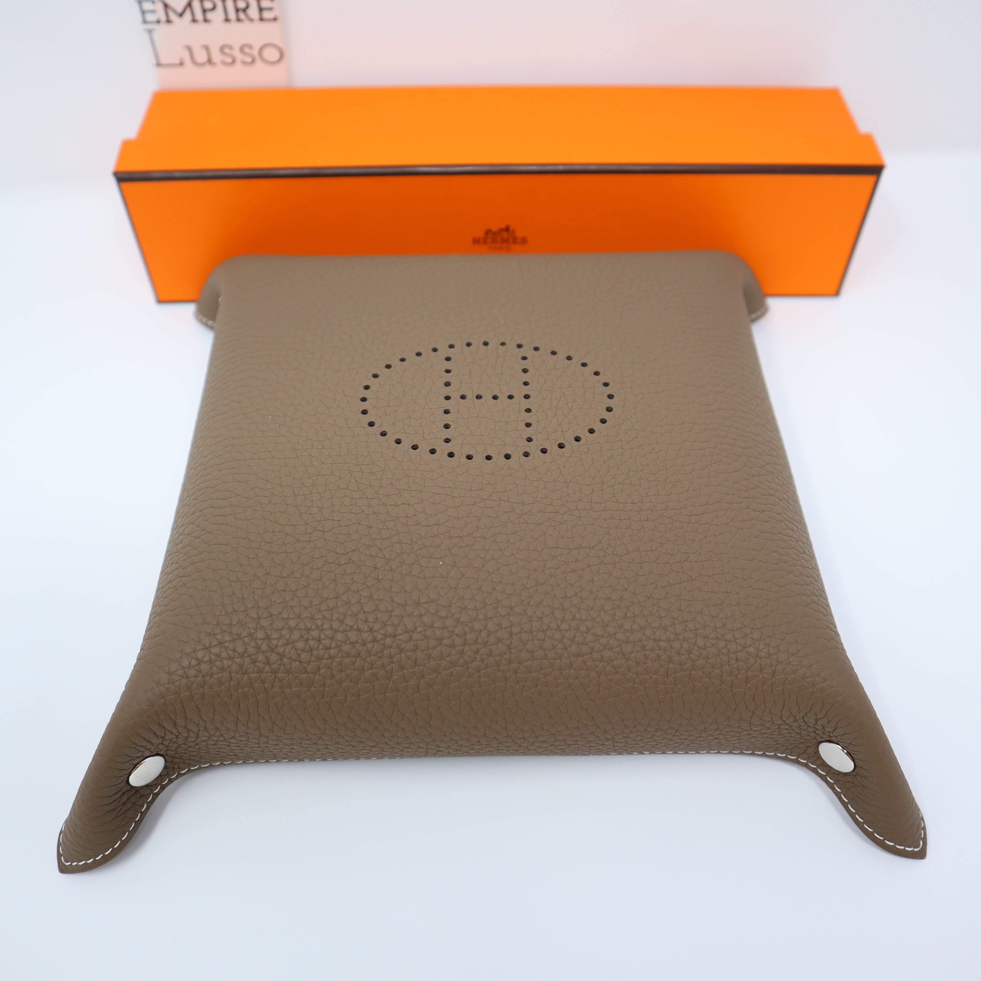 Hermès, an orange Clemence 'Mises et Relances' change tray, 2012