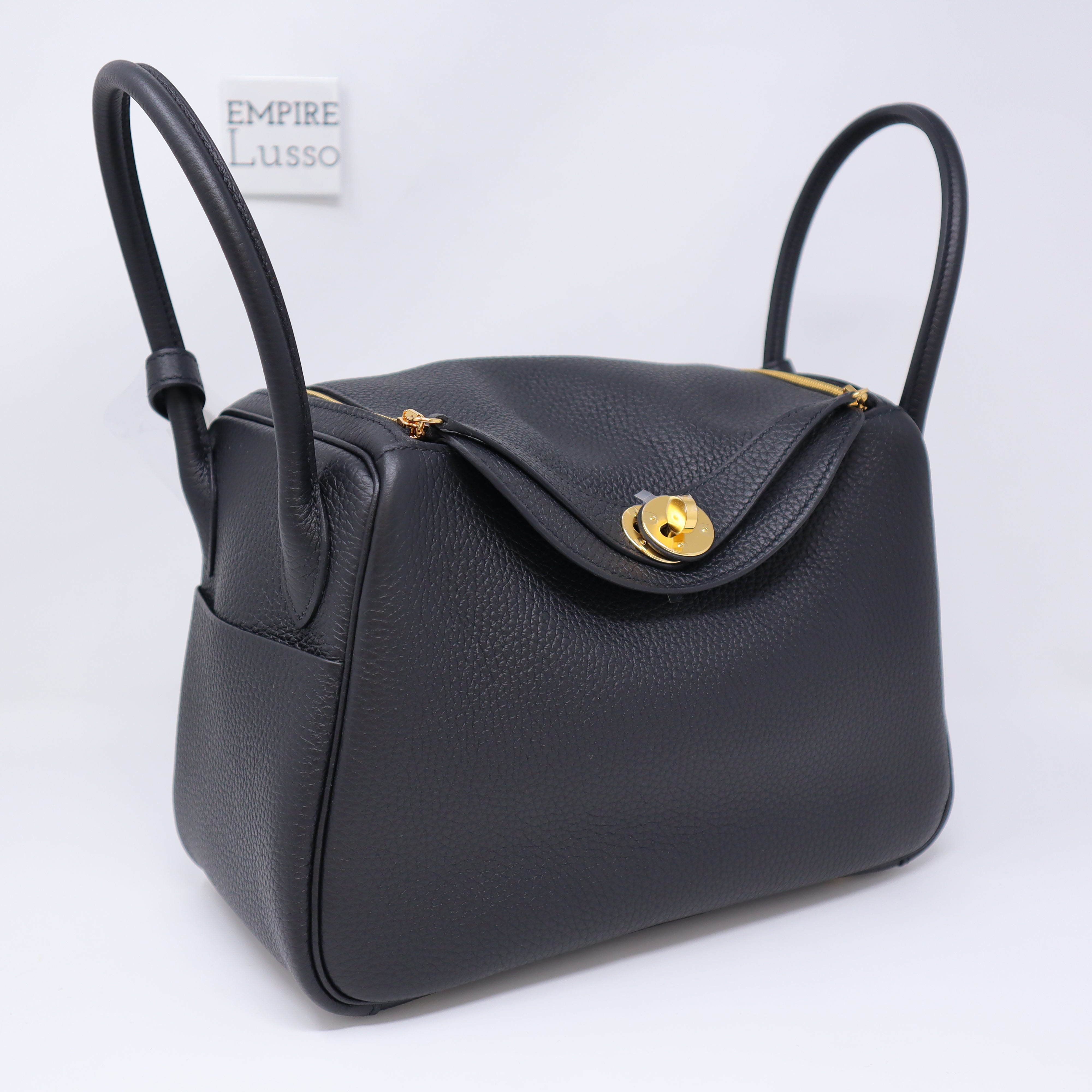 HERMÈS, BLACK RETOURNE KELLY 32CM OF CLEMENCE LEATHER WITH GOLD HARDWARE, Handbags & Accessories, 2020